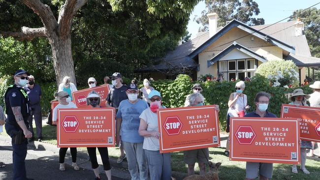 Residents and police at four houses in Service street Hampton that are at risk of being demolished. Picture: David Crosling