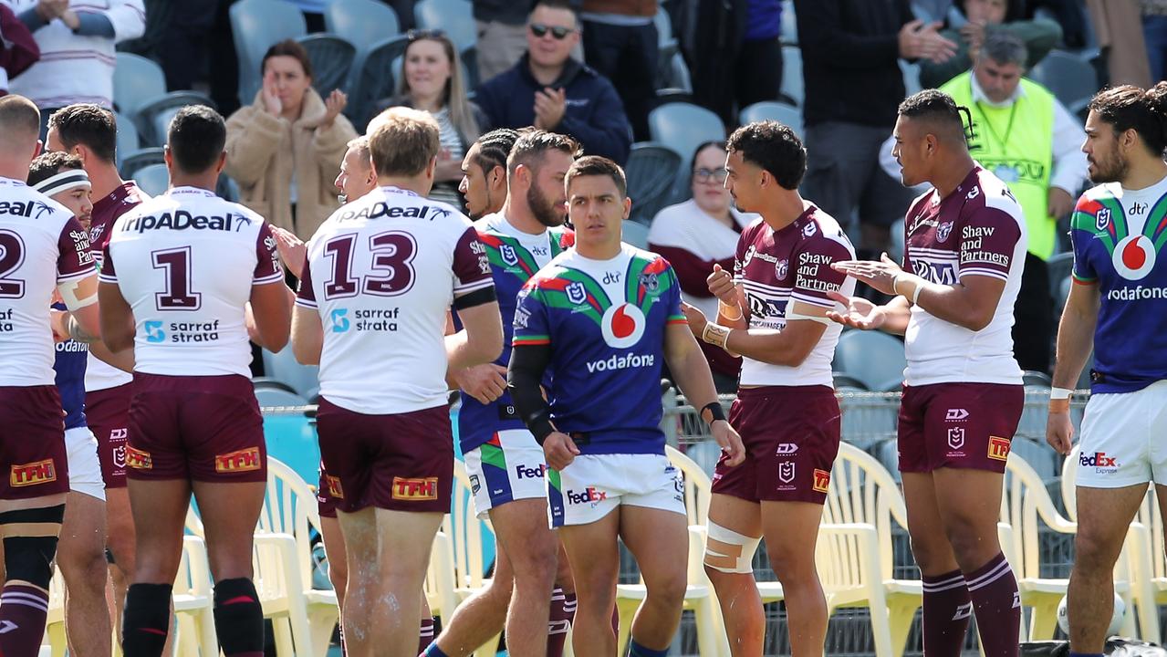 Sea Eagles players form a guard of honour for Warriors players at Central Coast Stadium.