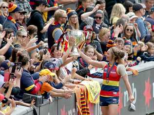 Jenna McCormick of the crows celebrates with fans during the AFLW grand final match between the Adelaide Crows and the Carlton Blues at Adelaide Oval in Adelaide, Sunday, March 31, 2019. (AAP Image/Kelly Barnes) NO ARCHIVING, EDITORIAL USE ONLY. Picture: KELLY BARNES