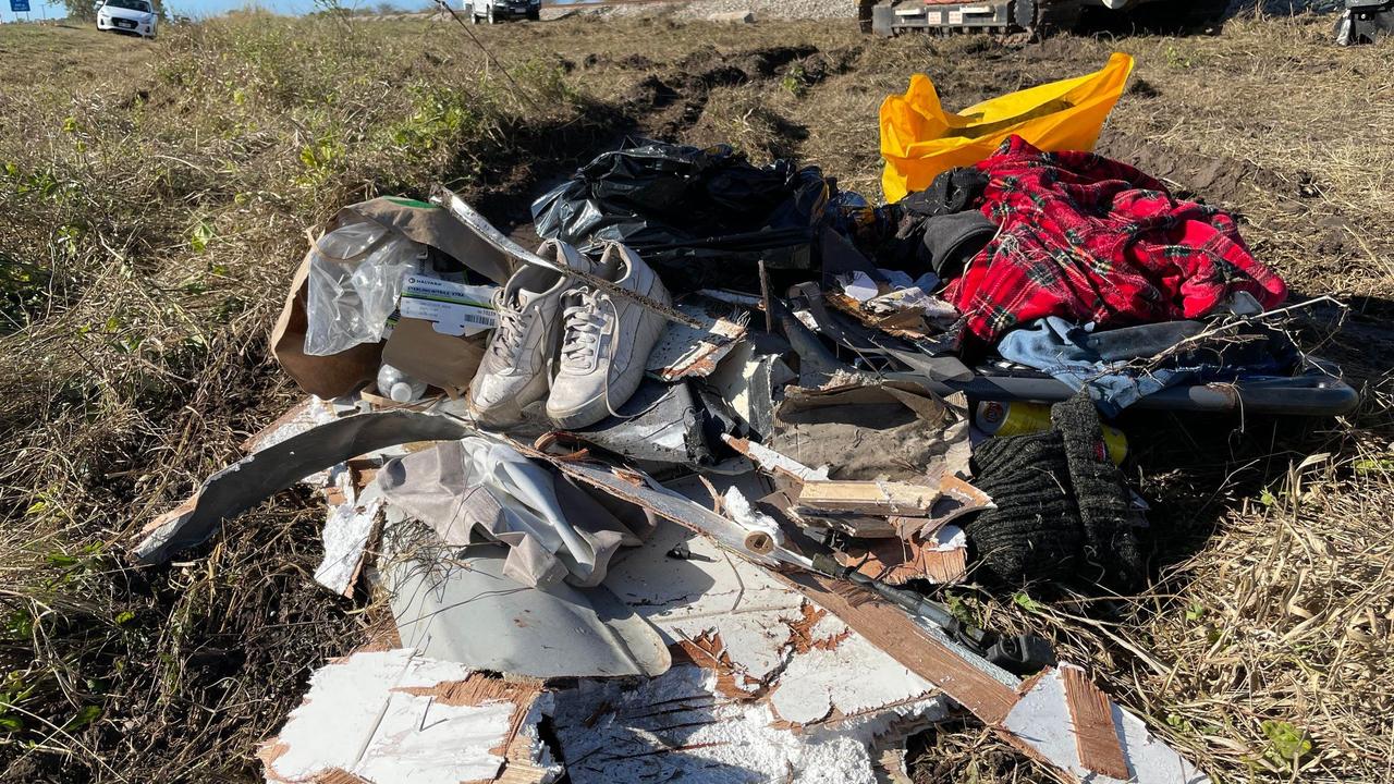 Items left behind after the Bruce Highway horror bus crash in Gumlu on Sunday. Picture: Leighton Smith