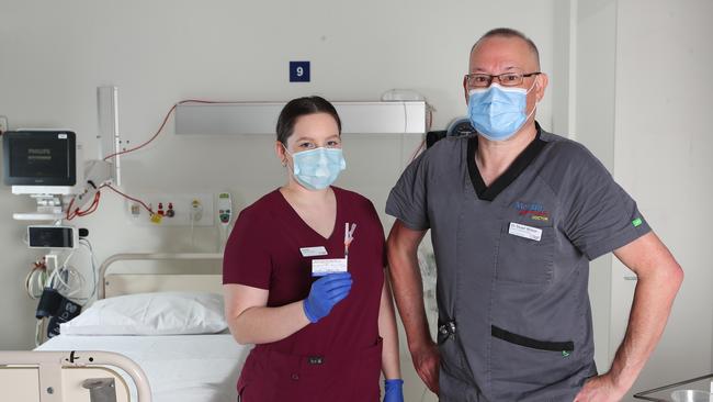 Dr Stuart Wilson of Monash Intensive Care Unit with nurse Grace Bartlett are excited to get the jab. Picture Rebecca Michael.