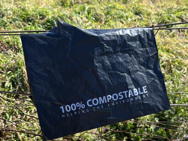 Hanging off the farm gate is the plastic bag where the propaganda starts, almost a metaphor for the green boot on farmers' throats., Inside black plastic, with "HELPING THE ENVIRONMENT" screaming across the label, is a notice warning your land will be ripped up to build 500KV towers, 80m high, 400 metres apart.