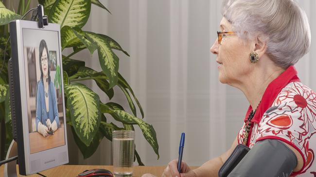 A woman visits her doctor via a telehealth service.