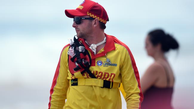 Life Saving Victoria lifeguard Jim Unkles on patrol at Gunnamatta beach. Picture: Jason Sammon