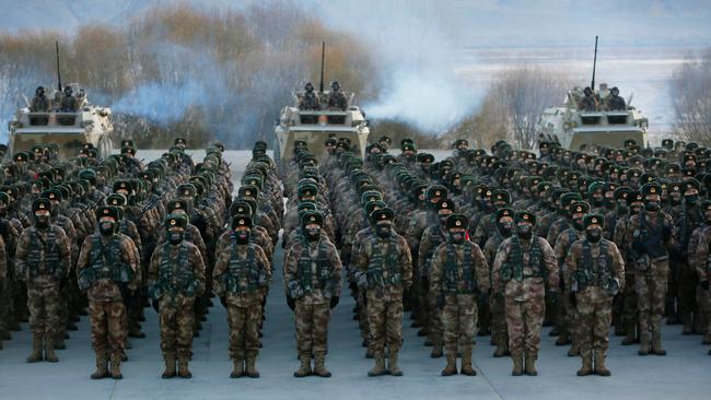 Chinese soldiers assembling during military training in China's Xinjiang region. Picture: AFP