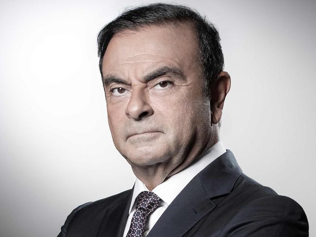 (FILES) In this file photo taken on September 12, 2018 French Renault group CEO and chairman of Japan's Nissan Motor CO. Ltd and Mitsubishi Motors Corp, Carlos Ghosn poses during a photo session at the Renault headquarters in Boulogne-Billancourt. - Nissan chairman Carlos Ghosn was reportedly under arrest in Tokyo on November 19, 2018, as his firm accused him of "significant acts of misconduct" and said it would seek to oust him. (Photo by JOEL SAGET / AFP)