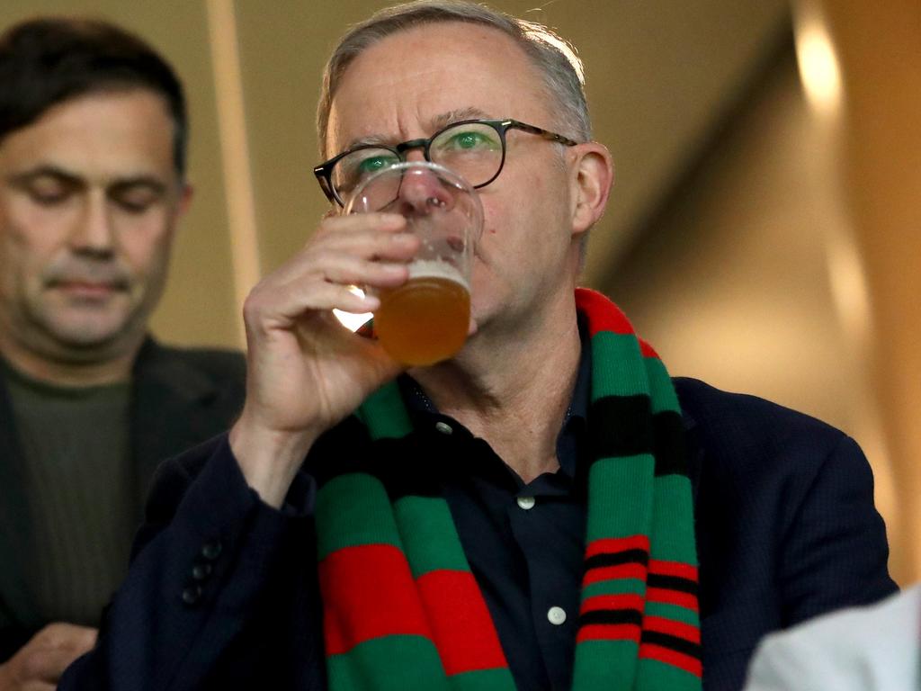 Prime Minister Anthony Albanese enjoys a beer while watching the Rabbitohs. Picture: Damian Shaw