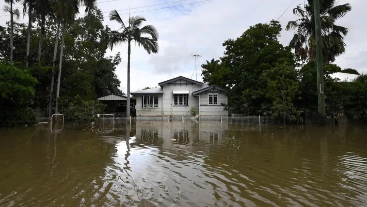 A house surrounded by flood water in Hermit Park in 2019’s floods. Picture: AAP Image/Dan Peled.