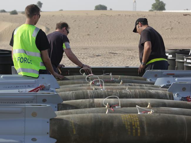 Loading up ... RAAF Armament Technicians inspect explosive ordnance prior to loading onto RAAF F/A-18F Super Hornets in the Middle East. Picture: Supplied