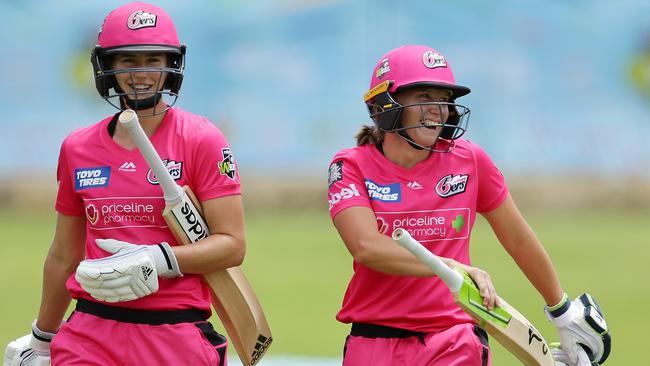 Ellyse Perry and Alyssa Healy leave the field at the end of their record partnership in Perth.