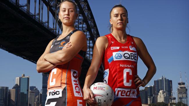 Jamie-Lee Price from the Giants (left) and Maddy Proud from the Swifts get their game faces on after their teams were announced as Round 1 Super Netball rivals. Picture: Tim Hunter