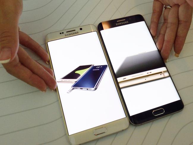 New phone ... Samsung employee displays the new Galaxy S6 edge +. Picture: AFP/Don Emmert