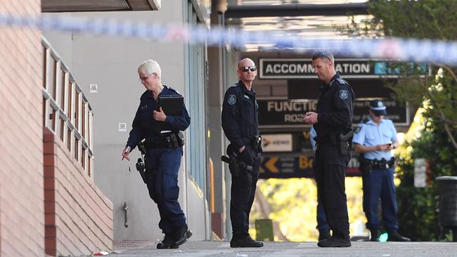 Police examine the crime scene outside Penrith Police Station. Picture: Joel Carrett