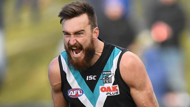 Charlie Dixon on his way to a five-goal haul for the Power. Picture: AAP Image/Julian Smith