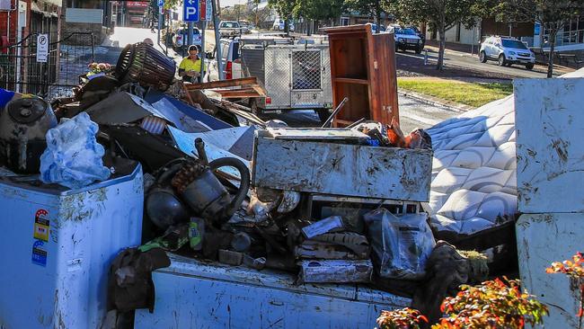 A pile of debris outside a massage and spa business on May 24, 2025 in Taree. Picture: Roni Bintang/Getty Images.