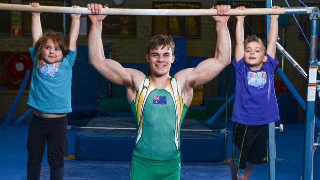 Champion SA gymnast and Commonwealth Gold hopeful Jesse Moore with Adalia 3yo and Alexander 5yo Ciavarella at Gymnastics SA in Marion. Picture: Brenton Edwards