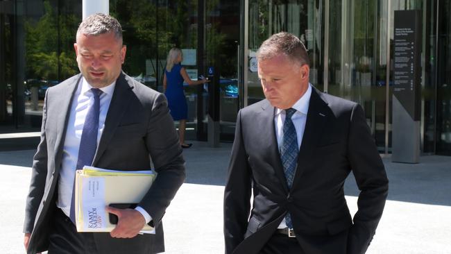 Canberra accountant Michael Anthony Papandrea (right) leaves the ACT Magistrates Court with defence lawyer Kamy Saeedi. Picture: Craig Dunlop