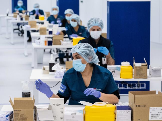 SYDNEY, AUSTRALIA - NewsWire Photos May 10, 2021:  Staff preparing vaccines in the pharmacy area of the NSW Vaccination Centre in Homebush, Sydney.Picture: NCA NewsWire / James Gourley  - POOL via NCA NewsWire