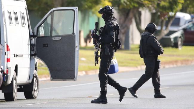 Armed police at the scene. Picture: Jono Searle