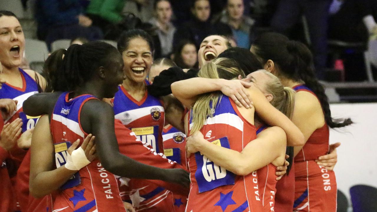 It’s ours: City West Falcons teammates embrace after their amazing achievement. Picture: Meg Saultry