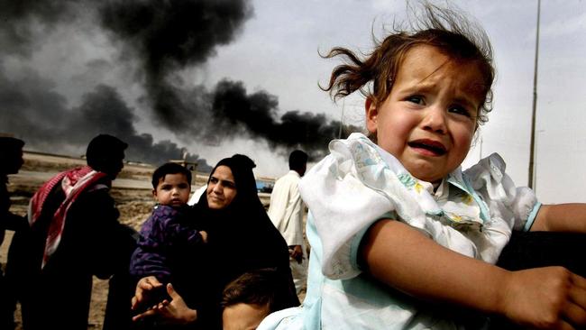 Iraqi families flee Basra in southern Iraq in March 2003. Picture: AFP