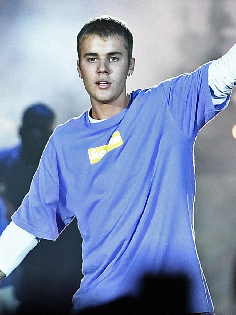 Police allege Chalmers posed as pop singer Justin Bieber (pictured) while talking with children to obtain the images. Picture: AFP