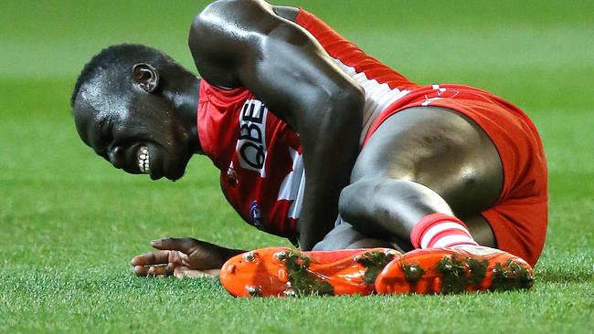 Aliir Aliir in pain after hurting his knee. Picture: George Salpigtidis