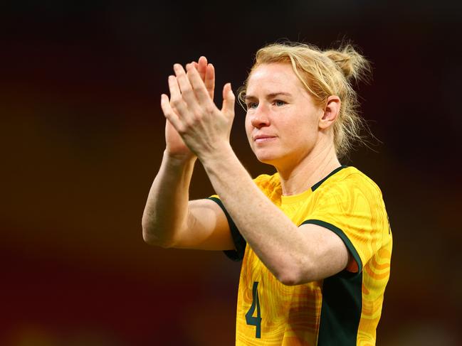 Retiring defender Clare Polkinghorne applauds the crowd at Suncorp Stadium. Picture: Chris Hyde/Getty Images