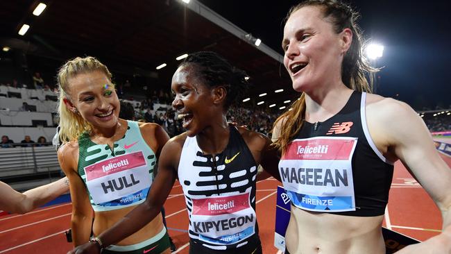 FLORENCE, ITALY - JUNE 02: Faith Kipyegon of Team Kenya interacts with Jessica Hull of Team Australia and Ciara Mageean of Team Ireland after victory in the Women's 1500m during the Golden Gala Pietro Mennea, part of the Diamond League series at Rodolfi Stadium on June 02, 2023 in Florence, Italy. (Photo by Valerio Pennicino/Getty Images)