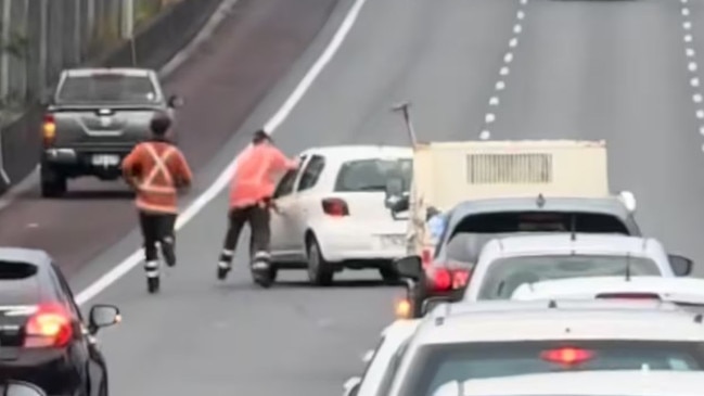 Chaos unfolded on an Auckland motorway yesterday morning as commuters jumped into action to stop a runaway car after its driver suffered a medical episode.