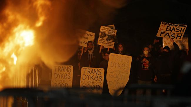 Protesters watch a fire on Sproul Plaza during a rally against the scheduled speaking appearance by Breitbart News editor Milo Yiannopoulos on the University of California at Berkeley campus. (Pic: AP/Ben Margot)