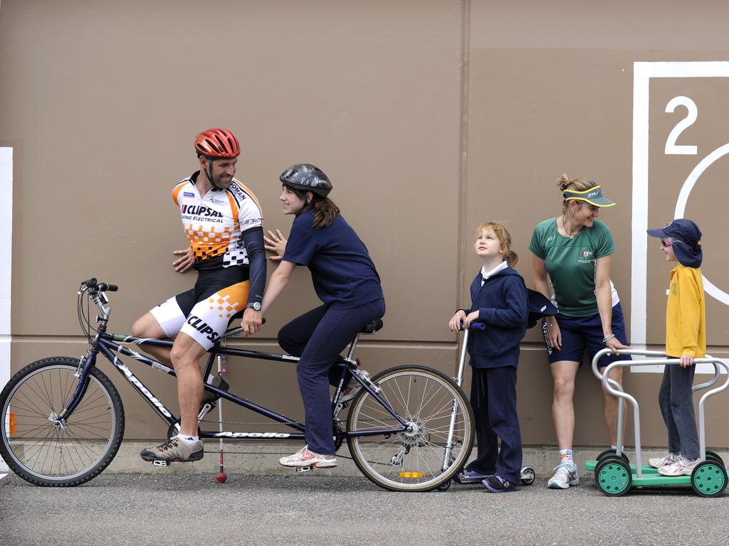 Kieran Modra and Felicity Johnson at South Australian School for Vision in Park Holme with students Holly, 11, Jordy, 8, Alana, 9, and Antony, 6.