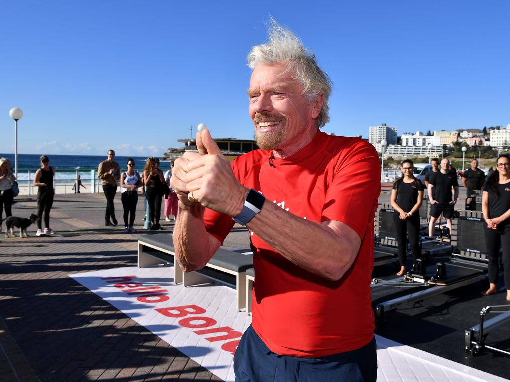 Sir Richard Branson speaks to the media before joining a pilates class at Bondi Beach in Sydney. Picture: AAP