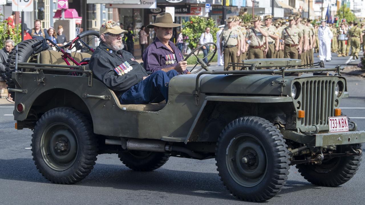 Ken Watson drives Wayne Foulds. Assembly in Neil St for the mid morning parade on ANZAC DAY. Tuesday, April 25, 2023. Picture: Nev Madsen.