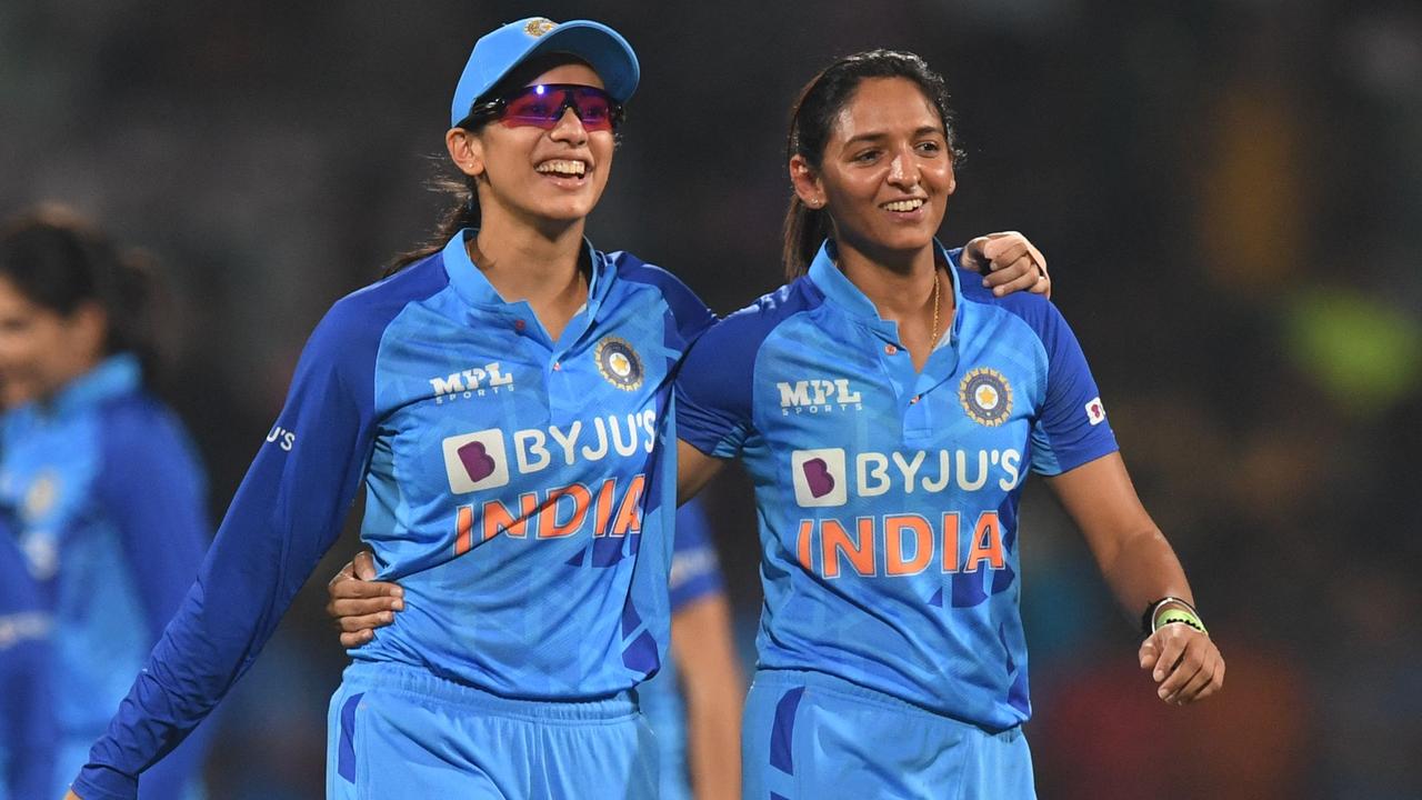 India's Smriti Mandhana (L) and Harmanpreet Kaur celebrate the win over Australia. (Photo by INDRANIL MUKHERJEE / AFP)