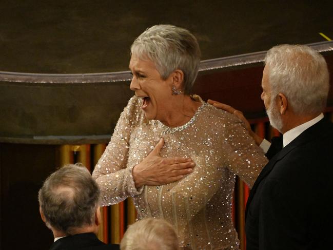 Jamie Lee Curtis celebrates after winning her Oscar. Picture: AFP