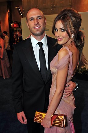 <p>While Chris came second in the 2009 Brownlow, Rebecca was again a fashion favorite in her sexy sheer J'Aton gown. Picture: Stephen Harman</p>