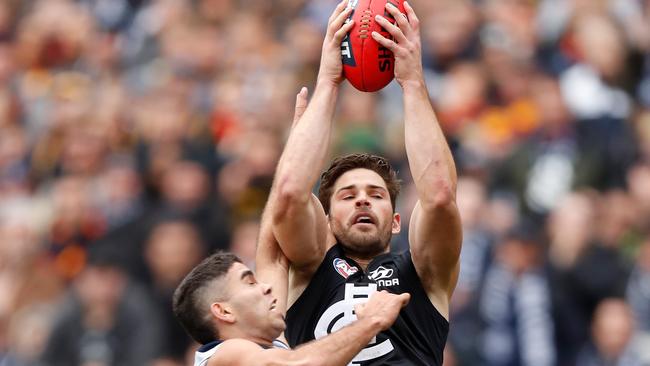 Levi Casboult climbs above Tyson Stengle to mark. Picture: Michael Willson/AFL Photos via Getty Images.