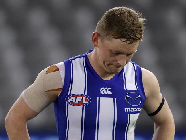 MELBOURNE, AUSTRALIA - AUGUST 14: Jack Ziebell of the Kangaroos looks dejected after a loss during the 2021 AFL Round 22 match between the North Melbourne Kangaroos and the Sydney Swans at Marvel Stadium on August 14, 2021 in Melbourne, Australia. (Photo by Michael Willson/AFL Photos via Getty Images)