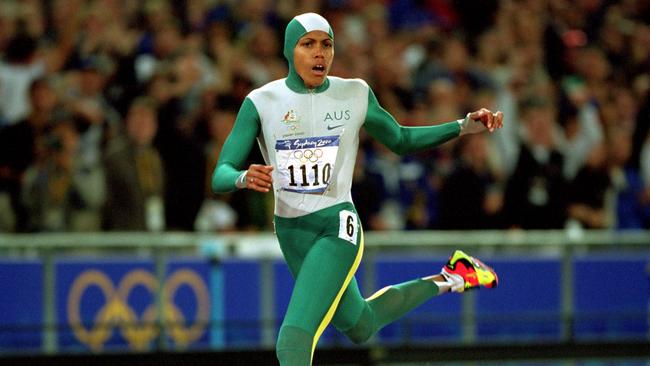 25 Sep 2000:  Cathy Freeman of Australia crosses the line to win gold in the Womens 400m Final at the Olympic Stadium on Day 10 of the Sydney 2000 Olympic Games in Sydney, Australia.  \\ Mandatory Credit: Mike Powell /Allsport