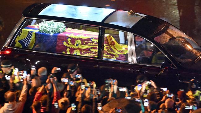 The coffin of Queen Elizabeth II is taken in the Royal Hearse to Buckingham Palace in London. Picture: Marco Bertorello / AFP