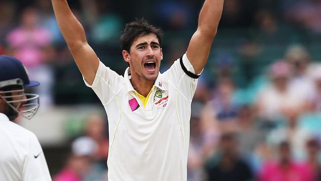 Australia's Mitchell Starc claims the wicket of Suresh Raina during Day 5 of 4th Test Australia v India at the SCG. pic. Phil Hillyard