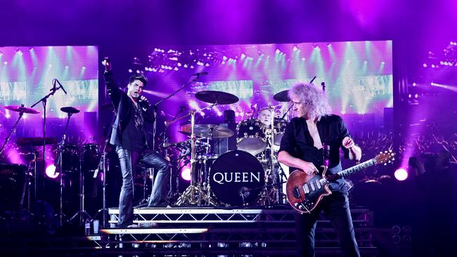 In Freddie’s memory  ... Adam Lambert performing with Queen members Brian May and Roger Taylor.