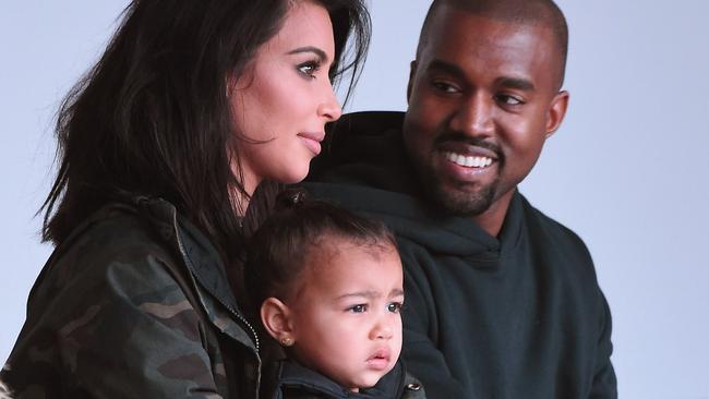 MUST CREDIT GETTY WEB RIGHTS ONLY NEW YORK, NY - FEBRUARY 12: Kim Kardashian, North West and Kanye West attend the adidas show during Mercedes-Benz Fashion Week Fall 2015 at Skylight Clarkson SQ. on February 12, 2015 in New York City. (Photo by Gary Gershoff/WireImage)