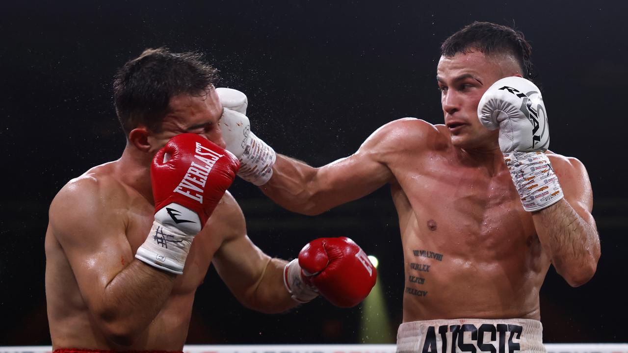 Harry Garside punches Charlie Bell. Photo by Darrian Traynor/Getty Images