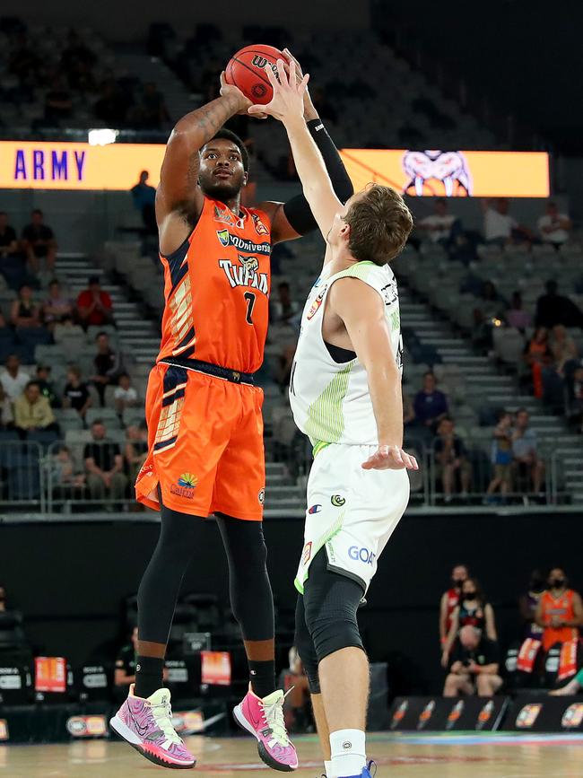 Cameron Oliver of the Taipans shoots over Phoenix’s Ryan Broekhoff. (Photo by Kelly Defina/Getty Images)