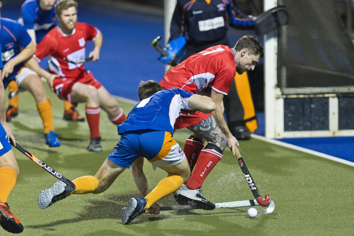 Craig Richards (left) of Newtown tackles Bradley Hobday of Red Lion in Toowoomba Hockey COVID Cup men round four at Clyde Park, Friday, July 31, 2020. Picture: Kevin Farmer