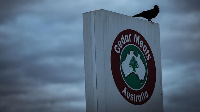 A crow sits about a Cedar Meats sign. Picture: Getty Images