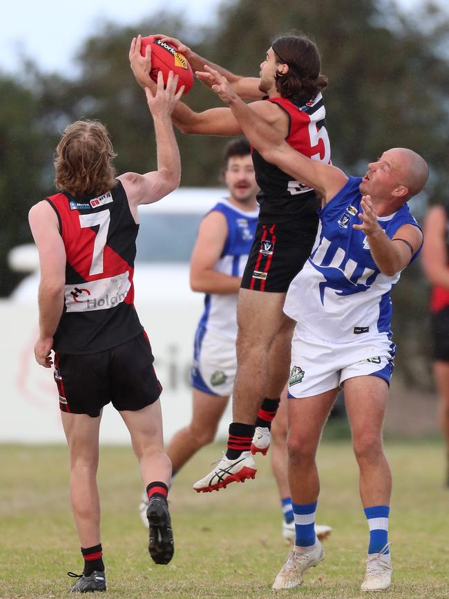 Irrewarra-Beac’s Toby Middleton drags down a strong mark.