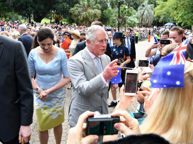 Prince Charles (centre), escorted by Queensland Premier Annastacia Palaszczuk (left), is greeted by public during a visit to Brisbane. Picture: Dan Peled/AAP